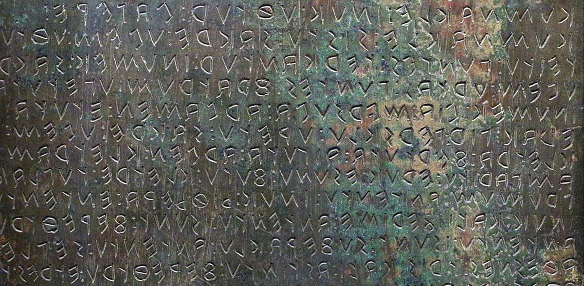 One of the Iguvine bronze tablets. Image via Wikimedia Commons.