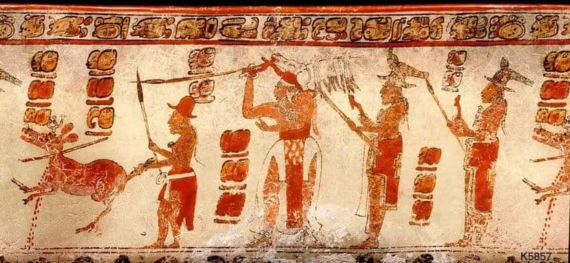 Hunting scene from a Maya vase, in which an attendant holds a wounded deer by its tail as a lord or ruler readies an atlatl dart to finish the kill. Photograph by Justin Kerr. Image and caption information via research.mayavase.com