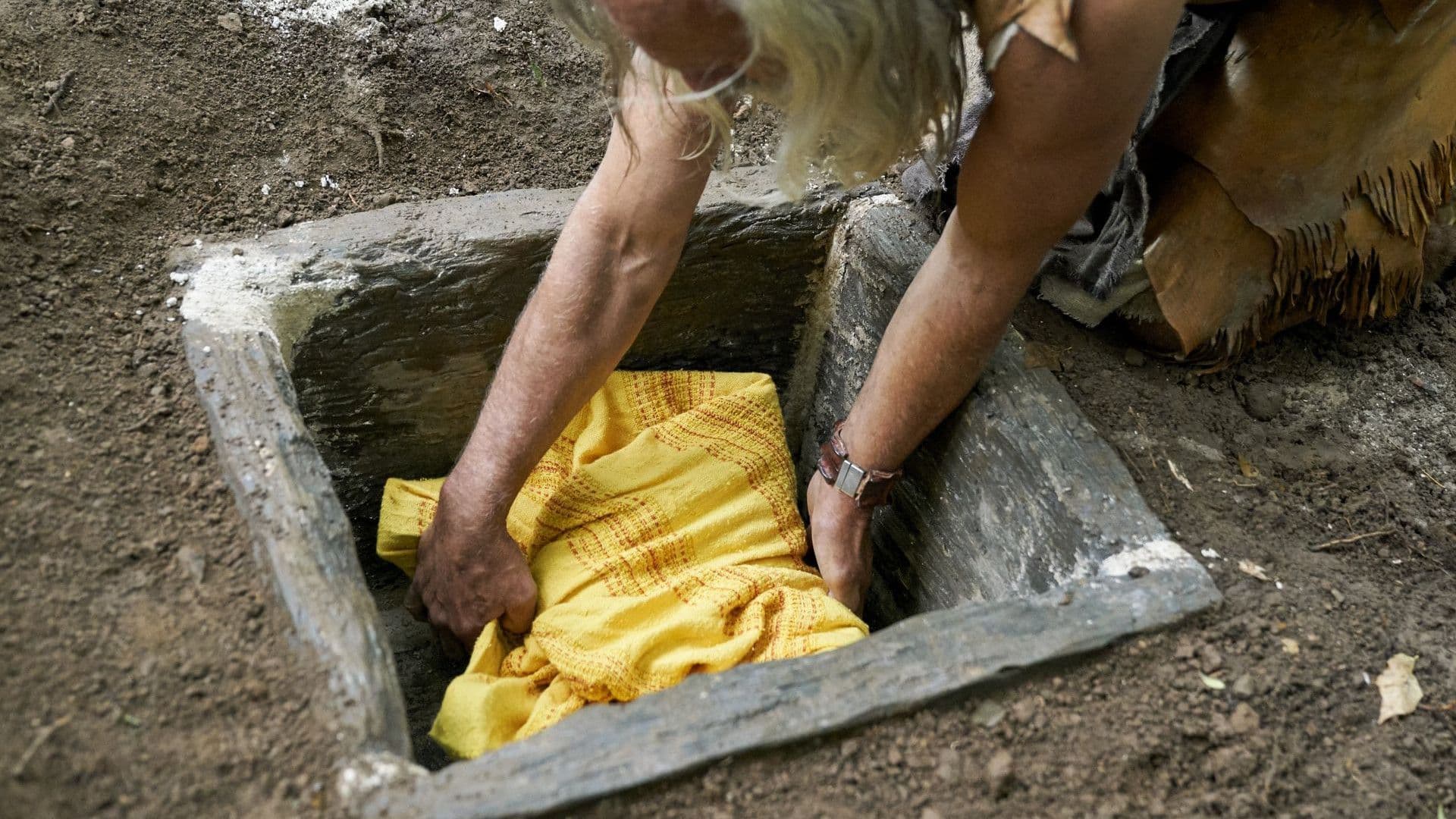 Moroni buries the gold plates in a stone box in this still from the Book of Mormon Videos of The Church of Jesus Christ of Latter-day Saints.
